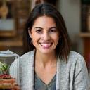 A smiling customer holding her new terrarium.